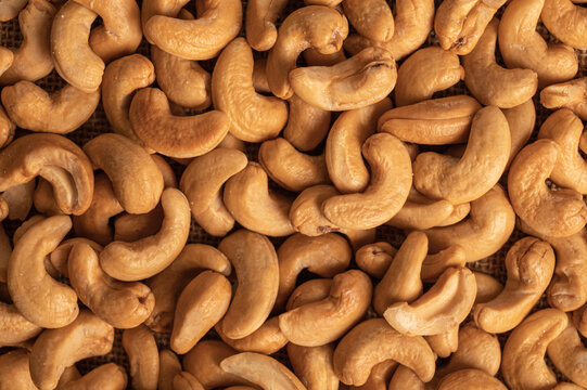 Roasted cashew nuts texture background. - Powered by Adobe