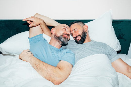 Gay Couple Cuddling in Bed