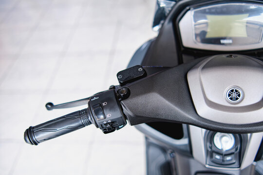 Motorcycles in the showroom Yamaha shop. Yamaha NMax motorcycle, selective focus.