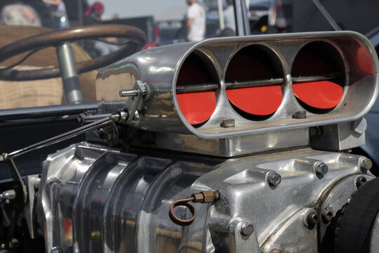 the engine head of an old rat rod classic car at a show