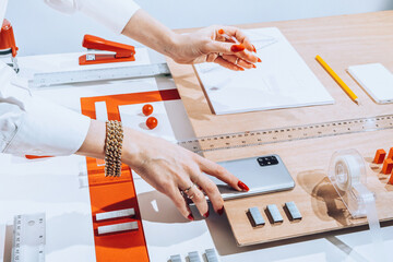 Hands using office stationary /objects/