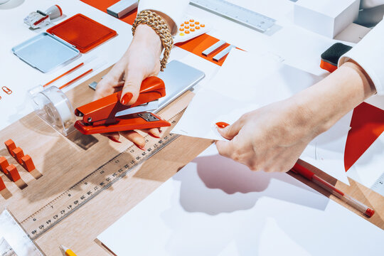 Hands using office stationary /objects/