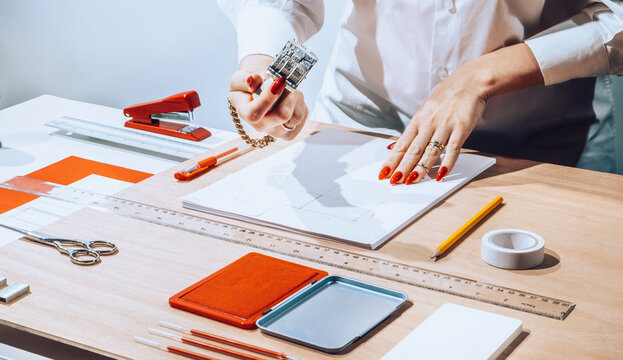 Hands using office stationary /objects/