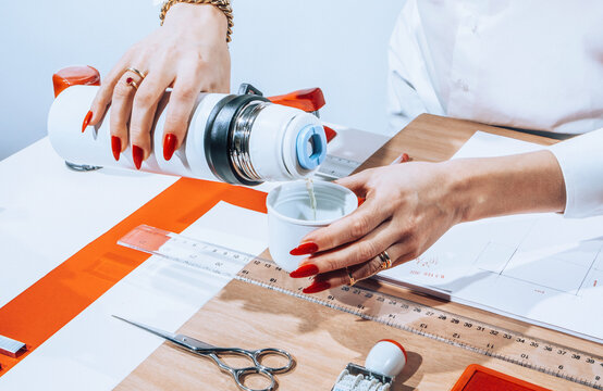 Hands using office stationary /objects/tea break