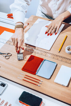 Hands using office stationary /objects/