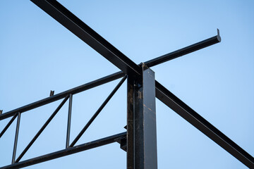 Balance beam and roof structure of the warehouse during it building. Construction building and...