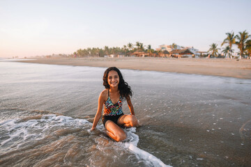 Latina teen similing at the beach