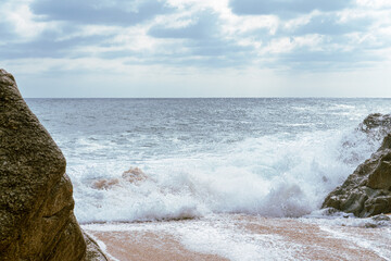 High Tides Coming on to the Rocky Shores of Costa Brava in Spain, cloudy weather