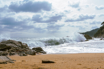 High Tides Coming on to the Rocky Shores of Costa Brava in Spain, cloudy weather