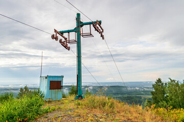 Old Rusty Abandoned Mountain Chairlift at Summer