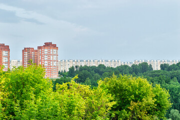 Fototapeta na wymiar Residential area behind the forest
