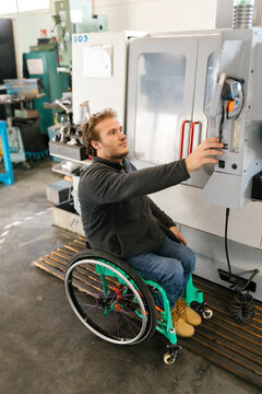 Disabled Worker Working With A Machine