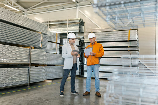 Supervisor In A Factory Inspection With A Worker