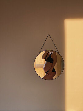 Self-portrait pf pregnant woman at mirror.