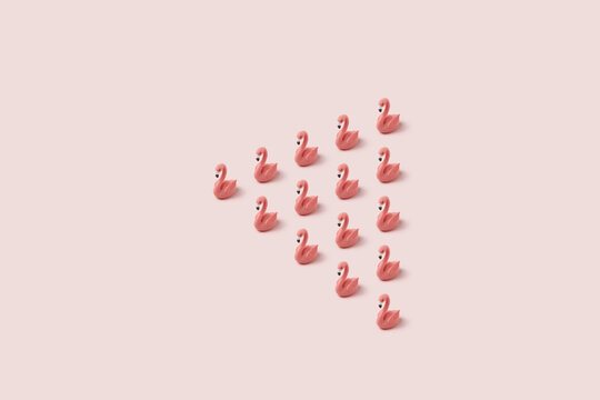 Pink easter flamingo toys arranged in shape of triangle