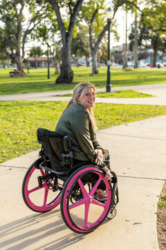Woman in Wheelchair Smiles at Camera