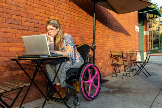 Woman in Wheelchair Works on her Computer