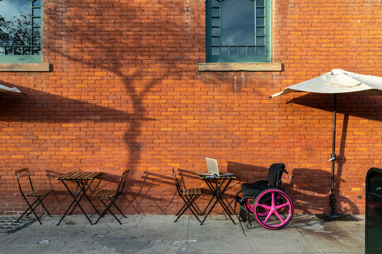 Wheelchair Replaces Chair at an Outdoor Cafe