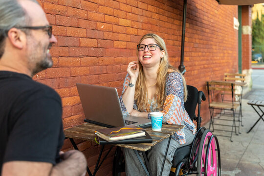 Woman in Wheelchair Smiles at Man