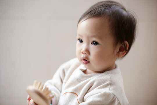 Closeup portrait of little cute asian baby

