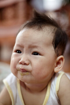 Closeup portrait of little cute asian baby

