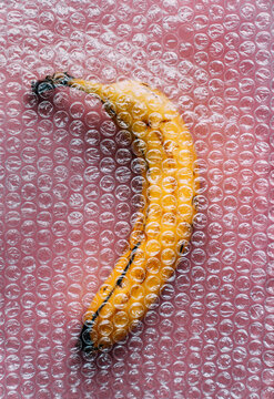 An overripe banana in a wrapper.