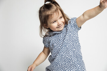 Little toddler girl modeling in studio