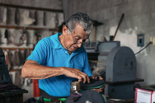 Artisan shoemaker working in his workshop
