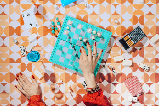 Female /Female Hands Playing Chess.