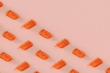 Pinks war tanks on a colorful background.