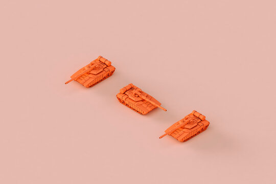 three Pinks war tanks pointing in different directions.