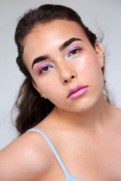 Young woman with fantasy violet and blue make up 