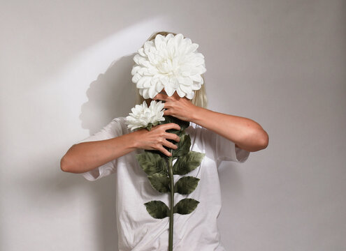 Woman Hiding Behind Flower