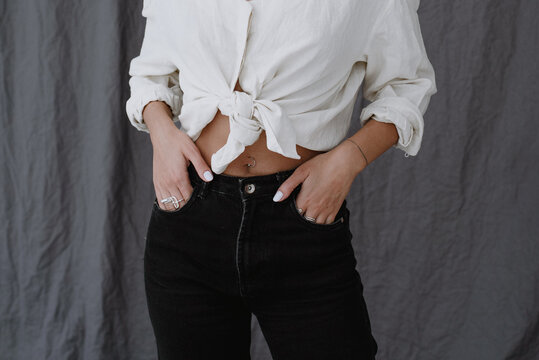 Anonymous crop of woman with hands on pockets