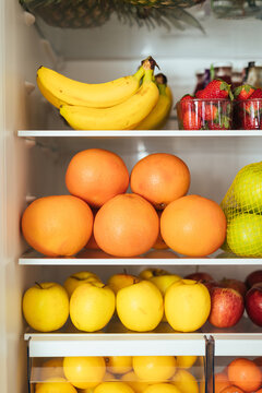 Healthy food concept: Fruits in open refrigerator