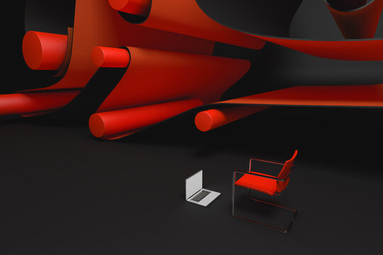 Laptop and chair next to an abstract background