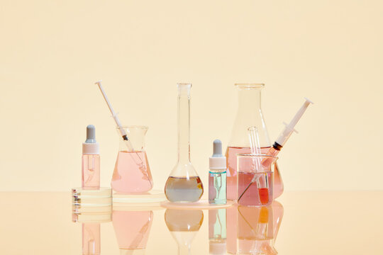 Volumetric laboratory glassware containing colored liquids