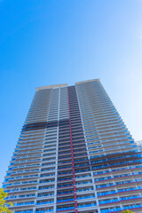 Fototapeta na wymiar Landscape photograph looking up at a high-rise apartment_c_19