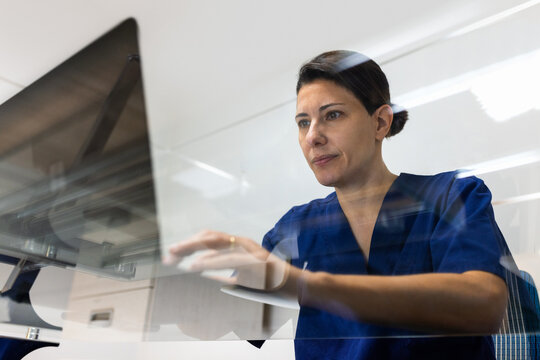 Doctor using a computer in the hospital office