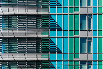 Building with blue and green windows 