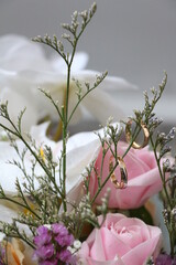 a pair of gold rings hanging on a flower branch