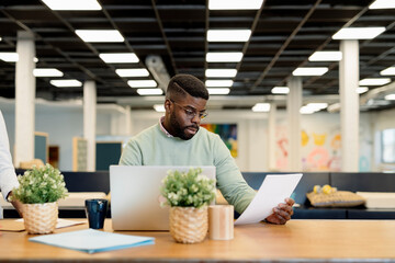 Male manager working in spacious workspace