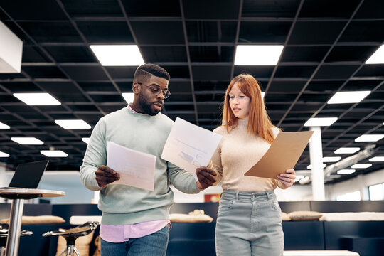 Colleagues working with papers together