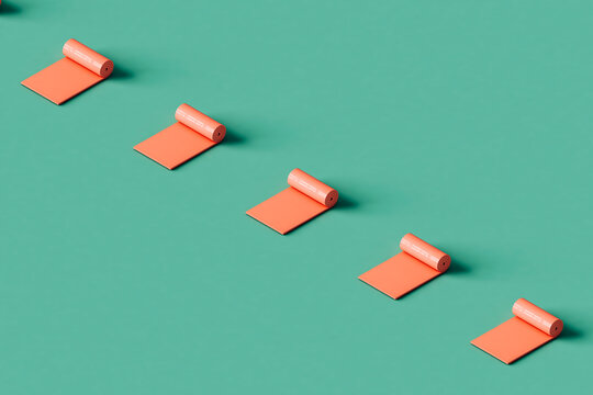 a row of pink fitness mats on a blue background