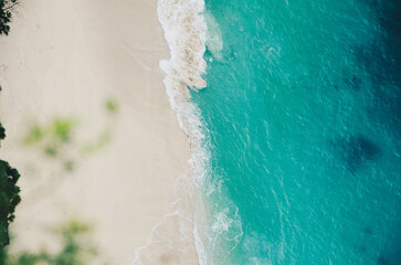Fototapeta na wymiar Beautiful white sand tropical beach view with blue sea water