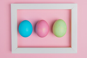 tricolor easter egg in a white frame