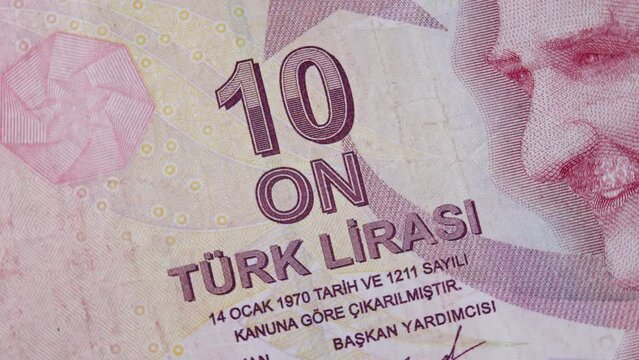 Monogram revolutionary statesman, founding father and first president Mustafa Kemal Ataturk on red 10 turkish lira paper money banknote. Monetary concept, official currency, TRY paper bill