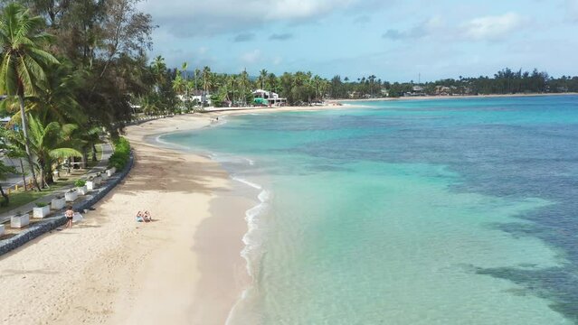 Turquoise seawater and seashore of Playa Punta Popy, Las Terrenas in Dominican Republic. Aerial drone view