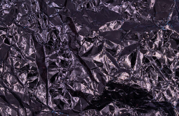 Abstract texture pattern metallic paper using as a background or wallpaper. Metal aluminum foil shiny and reflector