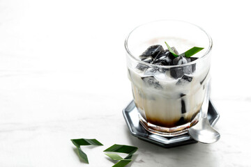 Es Cincau Hitam or Black Grass Jelly (Cincau Hitam), Indonesian Dessert Made from Cincau Leaf with Coconut Milk and Palm Sugar. Popular for Breakfasting during Ramadhan